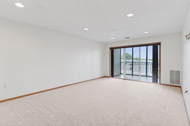 2231 Penn Pl Unit 224, North Saint Paul, MN 55109 - carpeted spare room with recessed lighting and a textured ceiling