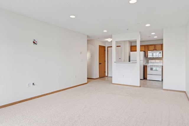 2231 Penn Pl Unit 224, North Saint Paul, MN 55109 - unfurnished living room with light carpet and recessed lighting