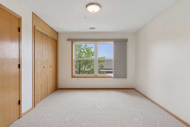 2231 Penn Pl Unit 224, North Saint Paul, MN 55109 - unfurnished bedroom with carpet flooring and a closet