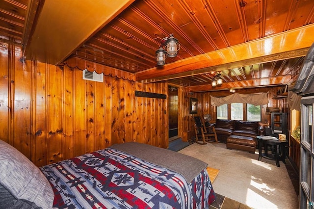 5607 Skogvei Rd, Duluth, MN 55803 - bedroom with a wood ceiling with exposed beams, wooden walls, and carpet flooring