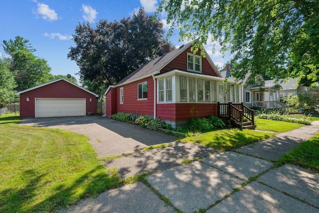178 Mainzer St, West Saint Paul, MN 55118 - bungalow-style house featuring an outdoor structure, a garage, a front yard, and a sunroom