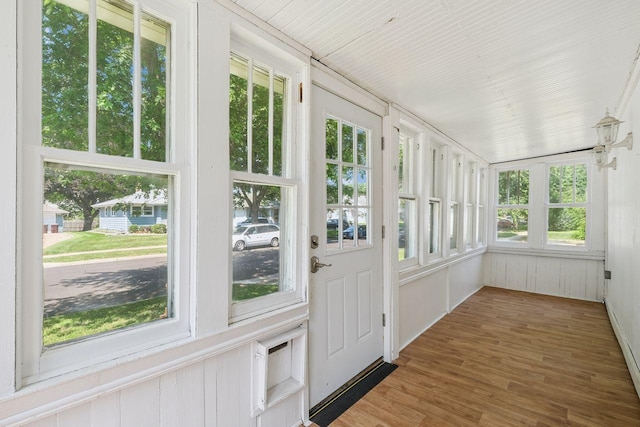 178 Mainzer St, West Saint Paul, MN 55118 - unfurnished sunroom with a baseboard radiator and wood finished floors