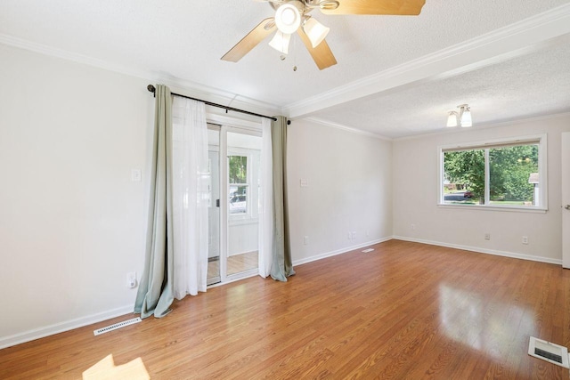 178 Mainzer St, West Saint Paul, MN 55118 - spare room with plenty of natural light, crown molding, ceiling fan, light wood-style floors, and a textured ceiling
