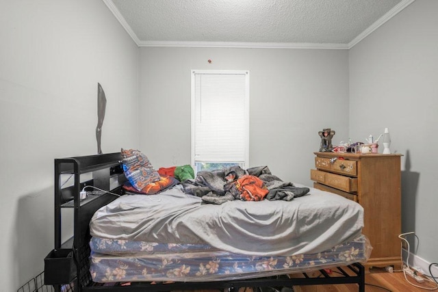 4111 Bryant Ave N, Minneapolis, MN 55412 - bedroom featuring wood finished floors, ornamental molding, and a textured ceiling