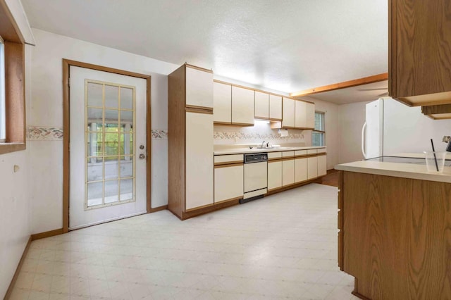 13425 Pillager Dam Rd SW, Sylvan Twp, MN 56473 - kitchen featuring light floors, light countertops, and white appliances