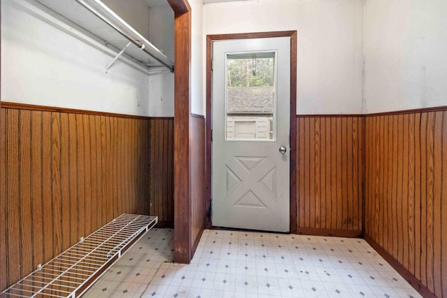 13425 Pillager Dam Rd SW, Sylvan Twp, MN 56473 - doorway with light flooring, wainscoting, and wooden walls
