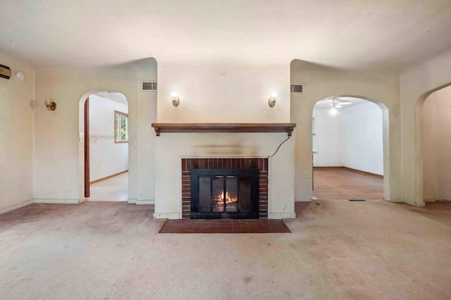13425 Pillager Dam Rd SW, Sylvan Twp, MN 56473 - unfurnished living room with arched walkways, carpet, and a fireplace