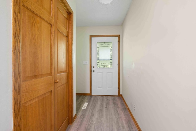 51800 500th St, Menahga, MN 56464 - doorway featuring light wood finished floors and baseboards