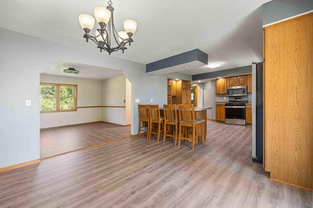 51800 500th St, Menahga, MN 56464 - dining space with light wood finished floors and a chandelier