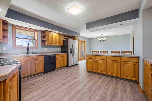 51800 500th St, Menahga, MN 56464 - kitchen with open shelves, electric stove, light wood-style flooring, dishwasher, and a textured ceiling