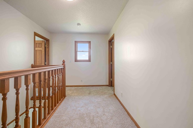 51800 500th St, Menahga, MN 56464 - corridor featuring an upstairs landing, light carpet, and a textured ceiling