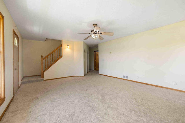 51800 500th St, Menahga, MN 56464 - unfurnished living room featuring ceiling fan, carpet floors, and stairway