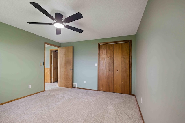51800 500th St, Menahga, MN 56464 - unfurnished bedroom with a closet, carpet flooring, a textured ceiling, and a ceiling fan