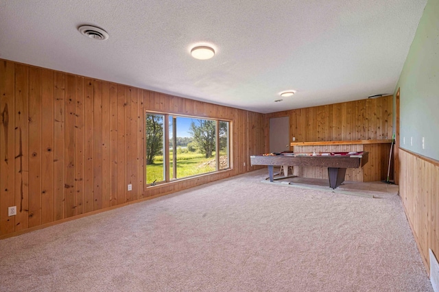 51800 500th St, Menahga, MN 56464 - playroom featuring wood walls, carpet floors, a textured ceiling, and billiards table