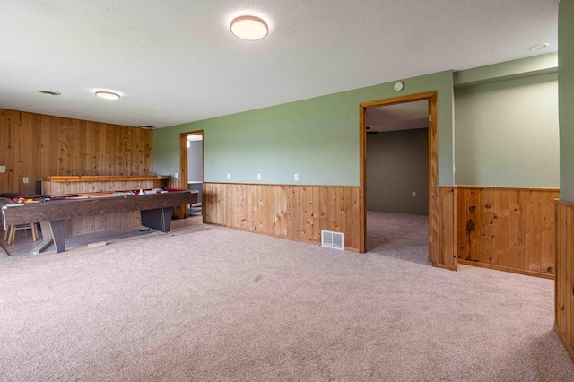 51800 500th St, Menahga, MN 56464 - interior space featuring wooden walls, wainscoting, pool table, carpet floors, and a textured ceiling