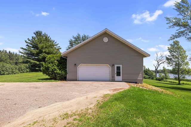 51800 500th St, Menahga, MN 56464 - view of side of home with a lawn and a garage