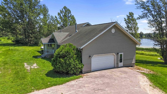 51800 500th St, Menahga, MN 56464 - view of side of property featuring driveway, a garage, a yard, and a water view