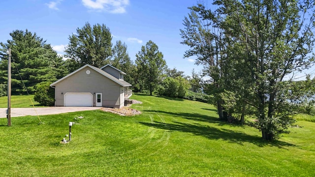 51800 500th St, Menahga, MN 56464 - view of side of home featuring driveway, a lawn, and an attached garage
