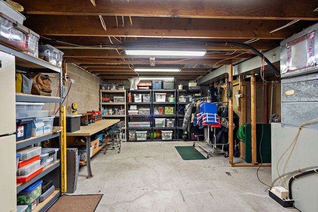 10315 Boundary Creek Ter, Maple Grove, MN 55369 - unfinished below grade area featuring heating unit and white fridge