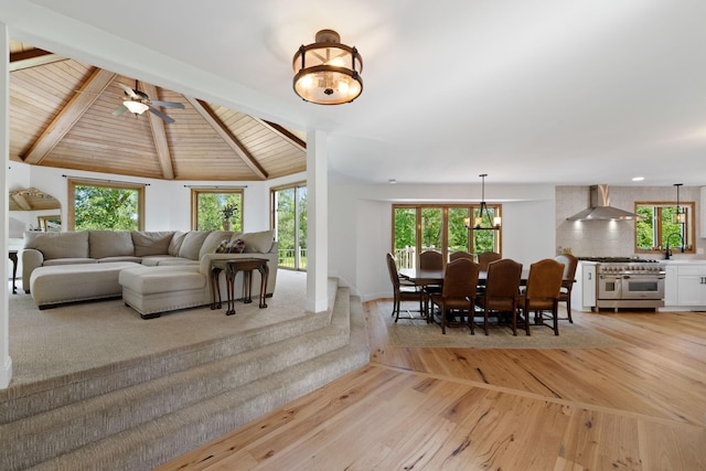 8045 County Road 116, Corcoran, MN 55340 - living room featuring light wood-style flooring, a wooden ceiling with exposed beams, and a ceiling fan