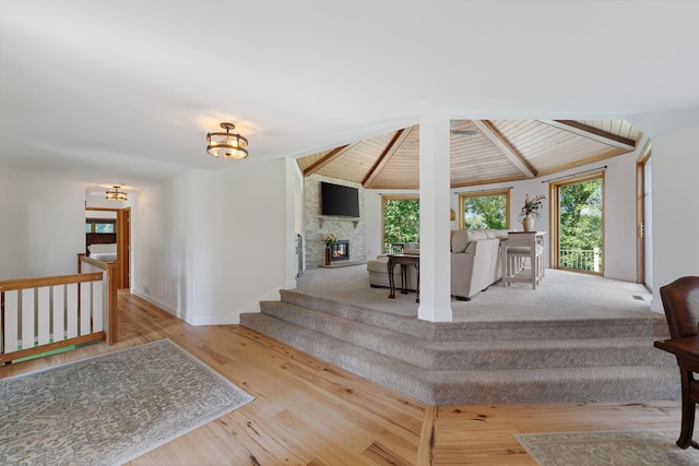 8045 County Road 116, Corcoran, MN 55340 - stairway featuring wood finished floors and a large fireplace