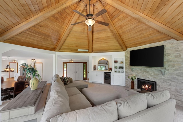 8045 County Road 116, Corcoran, MN 55340 - living room with a wooden ceiling with exposed beams, ceiling fan, a fireplace, wine cooler, and carpet flooring