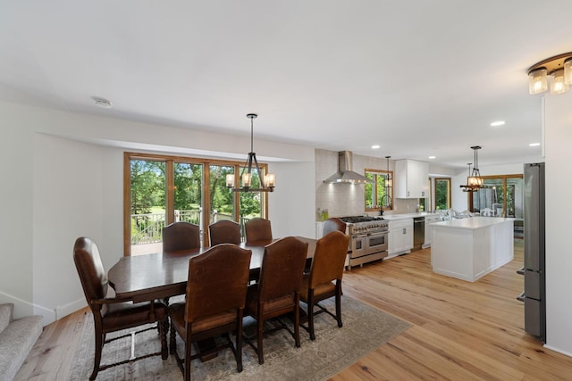 8045 County Road 116, Corcoran, MN 55340 - dining space with a chandelier, healthy amount of natural light, light wood-style flooring, and recessed lighting