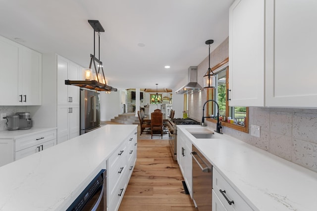 8045 County Road 116, Corcoran, MN 55340 - kitchen featuring decorative backsplash, light wood-style flooring, white cabinets, decorative light fixtures, and recessed lighting