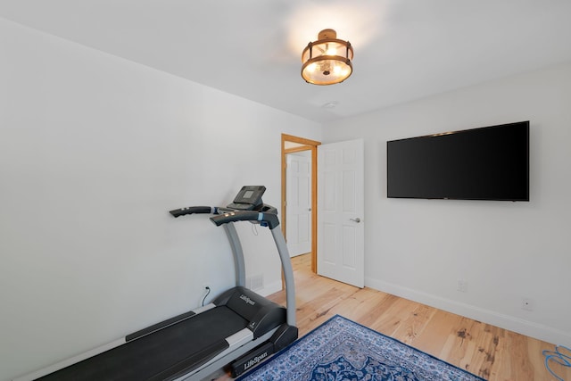 8045 County Road 116, Corcoran, MN 55340 - exercise room with wood finished floors and baseboards