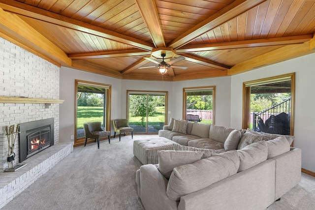 8045 County Road 116, Corcoran, MN 55340 - living room with light colored carpet, a fireplace, a ceiling fan, a wooden ceiling with exposed beams, and plenty of natural light