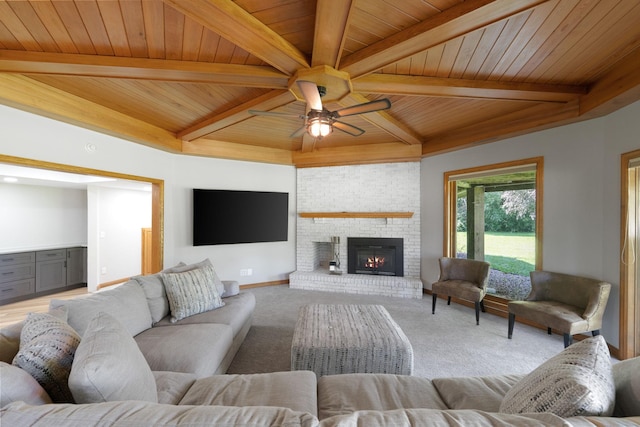 8045 County Road 116, Corcoran, MN 55340 - living area with a wooden ceiling with exposed beams, light colored carpet, ceiling fan, and a fireplace