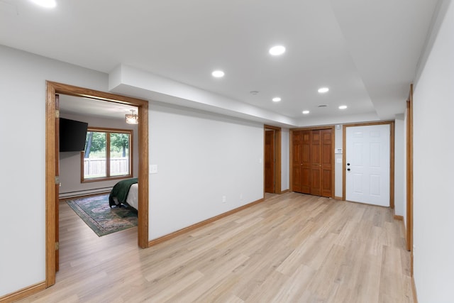 8045 County Road 116, Corcoran, MN 55340 - spare room with light wood finished floors, recessed lighting, and a baseboard heating unit
