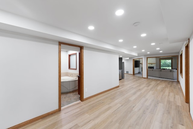 8045 County Road 116, Corcoran, MN 55340 - unfurnished living room with light wood-style floors and recessed lighting