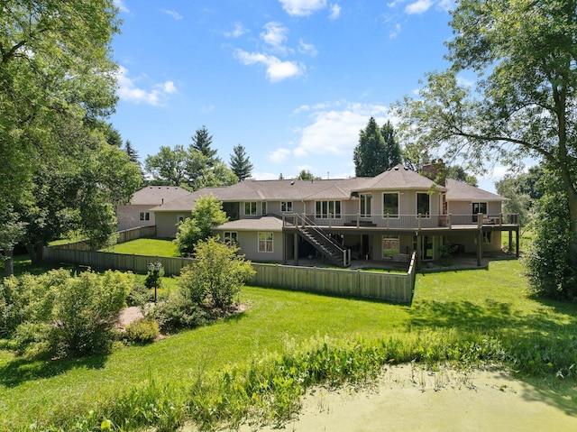 8045 County Road 116, Corcoran, MN 55340 - rear view of house featuring a deck, stairway, and a chimney