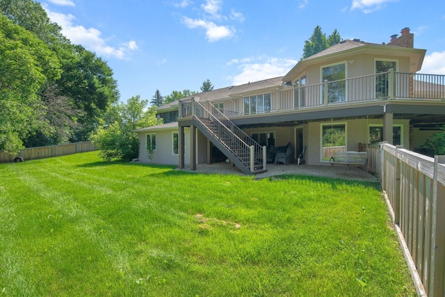 8045 County Road 116, Corcoran, MN 55340 - rear view of property with stucco siding, stairway, a fenced backyard, and a chimney