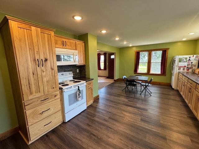 31845 615th Ave, Compton Twp, MN 56482 - kitchen featuring white appliances, dark wood-style flooring, recessed lighting, tasteful backsplash, and dark countertops