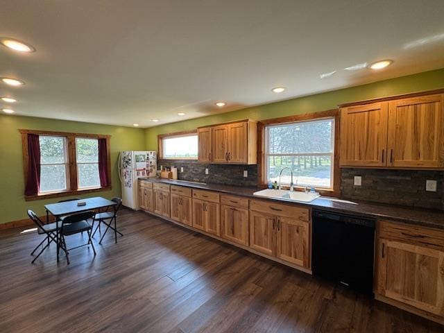 31845 615th Ave, Compton Twp, MN 56482 - kitchen featuring dark countertops, dishwasher, freestanding refrigerator, recessed lighting, and tasteful backsplash
