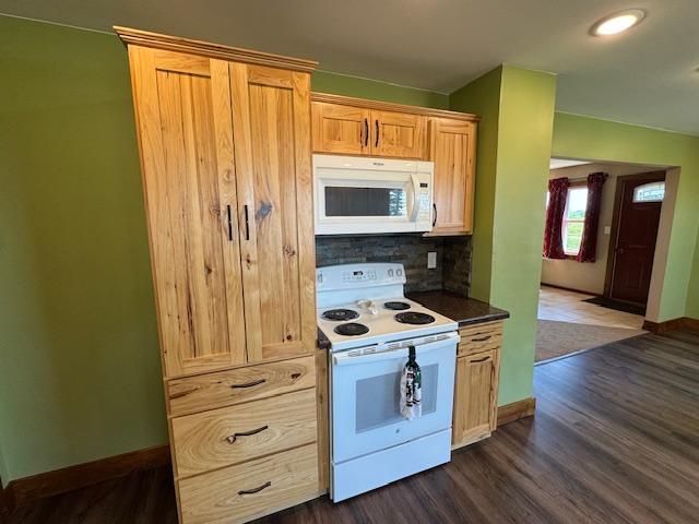 31845 615th Ave, Compton Twp, MN 56482 - kitchen with white appliances, dark countertops, tasteful backsplash, dark wood-style flooring, and recessed lighting