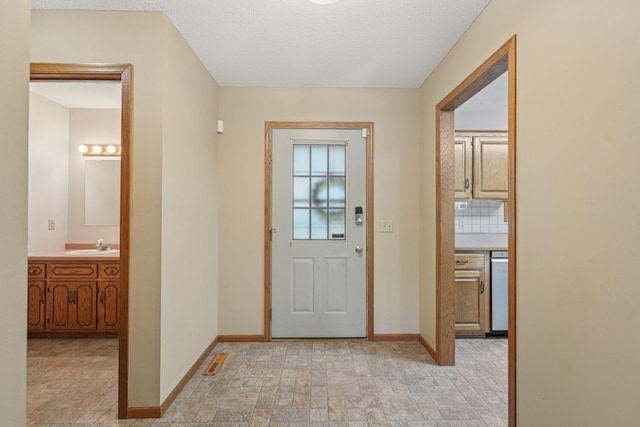 24864 Kettle River Blvd, Wyoming, MN 55025 - foyer featuring stone finish flooring and a textured ceiling