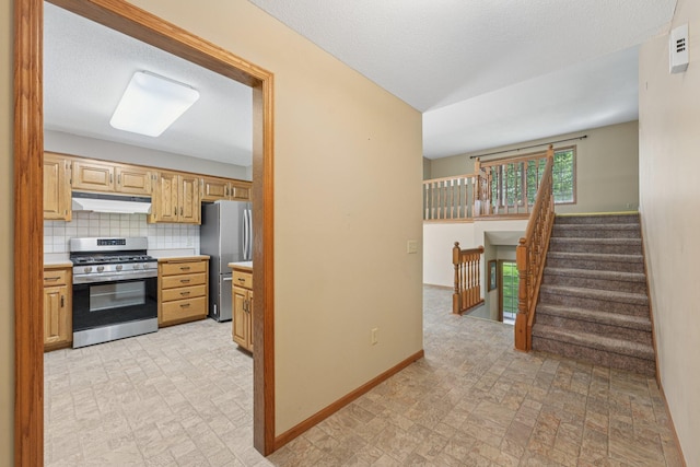 24864 Kettle River Blvd, Wyoming, MN 55025 - kitchen with appliances with stainless steel finishes, light countertops, brick patterned floors, and backsplash