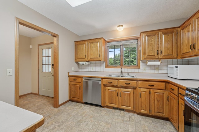 24864 Kettle River Blvd, Wyoming, MN 55025 - kitchen featuring appliances with stainless steel finishes, decorative backsplash, light countertops, and brown cabinets