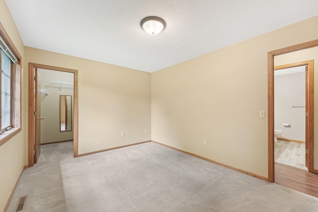 24864 Kettle River Blvd, Wyoming, MN 55025 - unfurnished room featuring light carpet and baseboards