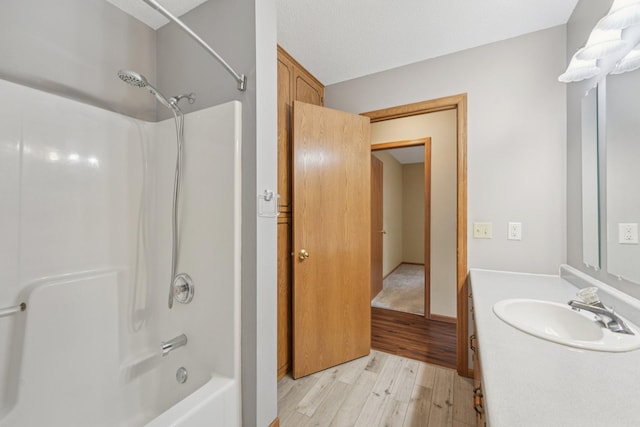24864 Kettle River Blvd, Wyoming, MN 55025 - full bathroom featuring wood finished floors, shower / washtub combination, and vanity