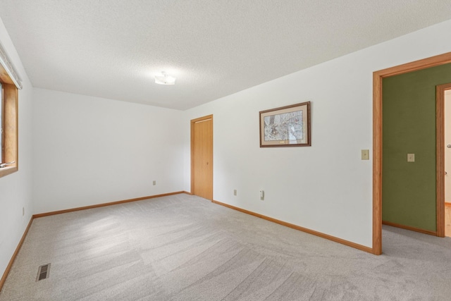 24864 Kettle River Blvd, Wyoming, MN 55025 - unfurnished room featuring light carpet and a textured ceiling