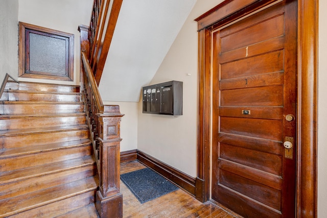 400 8th Ave NE Unit 1, Minneapolis, MN 55413 - stairs featuring baseboards and wood finished floors