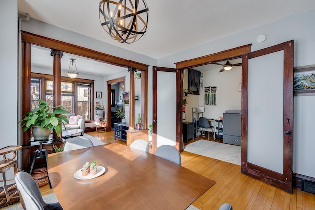 400 8th Ave NE Unit 1, Minneapolis, MN 55413 - dining area featuring hardwood / wood-style floors, a ceiling fan, and a chandelier