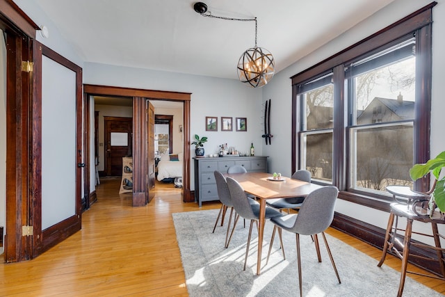 400 8th Ave NE Unit 1, Minneapolis, MN 55413 - dining room with a chandelier and light wood finished floors