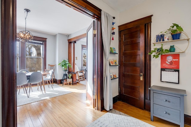 400 8th Ave NE Unit 1, Minneapolis, MN 55413 - foyer entrance featuring a chandelier and light wood-style flooring