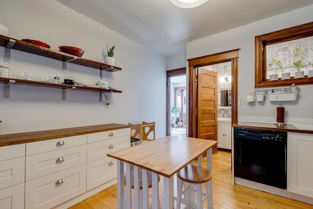 400 8th Ave NE Unit 1, Minneapolis, MN 55413 - kitchen with dishwasher, wooden counters, white cabinets, and light wood-type flooring