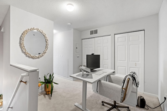 660 2nd St Unit 104, Minneapolis, MN 55401 - carpeted home office with baseboards and a textured ceiling